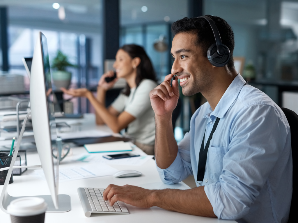 Man talking on phone supporting a client doing business