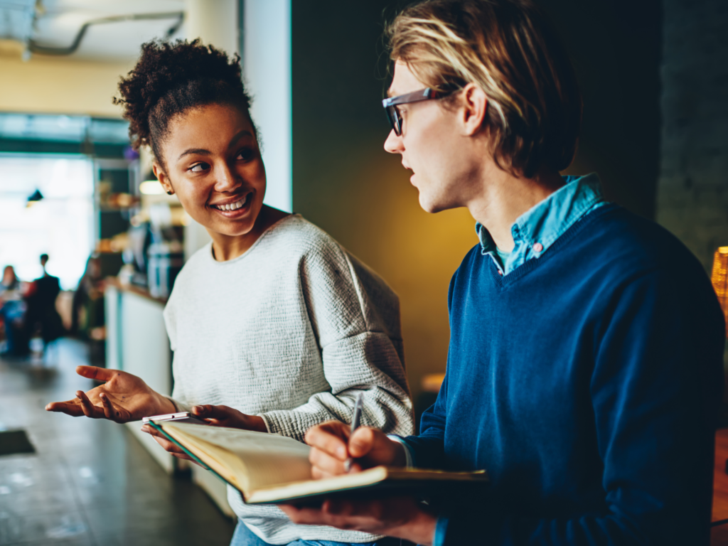 Man talking to woman about business decisions
